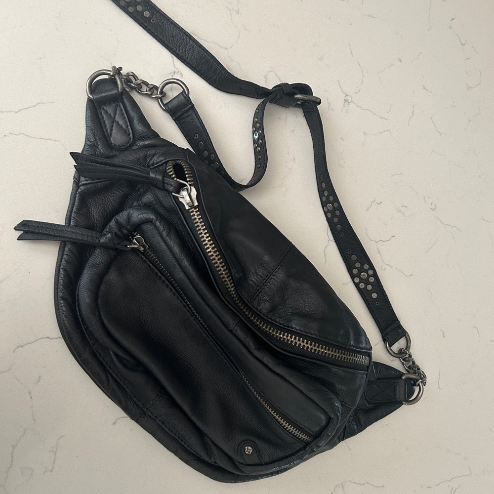 Free People Leather Studded Archer Sling Bag in color Black.